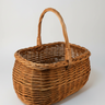 Cesta ovalada de mimbre buff hecha a mano 38x30 cm