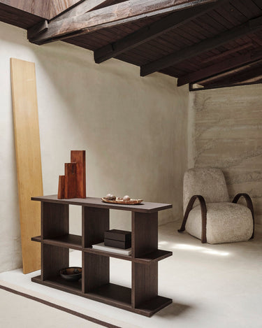 Low dark wood shelving unit