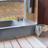 Alfombra lavable de algodón geométrica beige con flecos, vista completa
