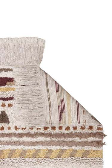 Diseño nómada en tonos tierra de una alfombra lavable de algodón
