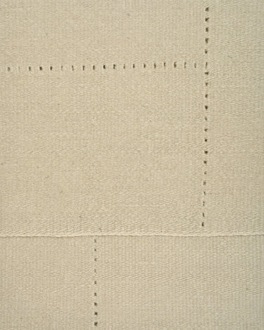 Sand wool rug with an openwork pattern by Linie Design, close-up of the open lines