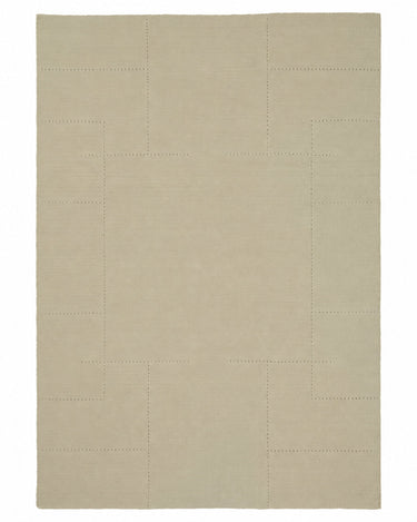 Sand wool rug with an openwork pattern by Linie Design, full view of the geometric openwork pattern