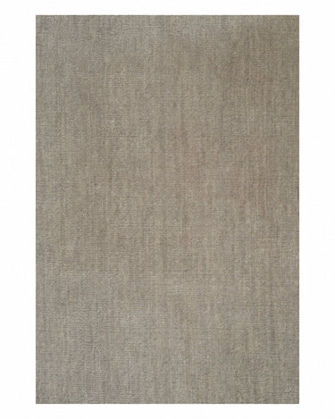 Sand wool rug with linen fringes by Linie Design, detail of the sand-coloured surface