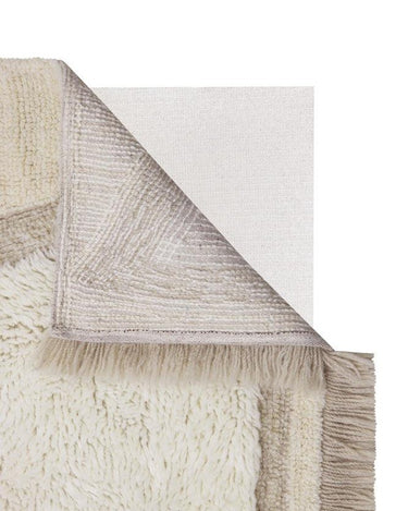 Diseño abstracto en relieve de una alfombra lavable de lana beige