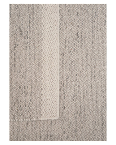 Alfombra de lana jaspeada clara reversible de Linie Design: detalle del pliegue y la trama.