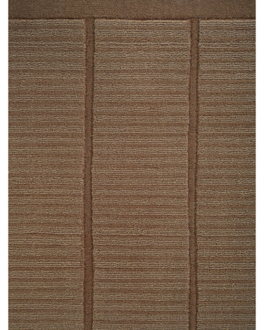 Alfombra de lana mostaza con cuadrícula de Linie Design: detalle del anudado y el dibujo geométrico.