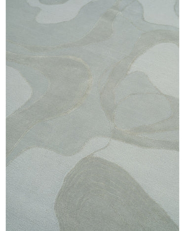 Alfombra de lana y seda verde menta con ondas de Linie Design: detalle de las ondas y las texturas.
