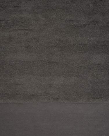 Alfombra de lana verde musgo con diseño de ojo eterno en relieve Eternal Eye Linie Design