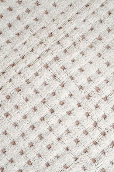 Textura de pelo corto de una alfombra lavable de lana natural