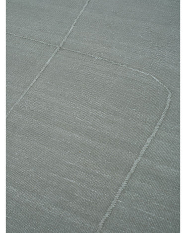 Alfombra de lino gris menta con líneas orgánicas de Linie Design: detalle de las líneas orgánicas.