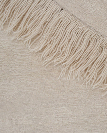 Detalle de la alfombra de lana beige Oceanic Reef