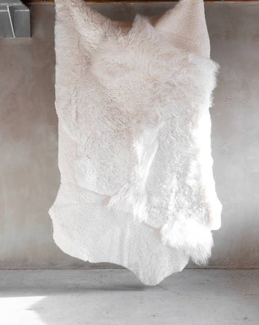 Alfombra de piel de oveja melange blanca, suave y única