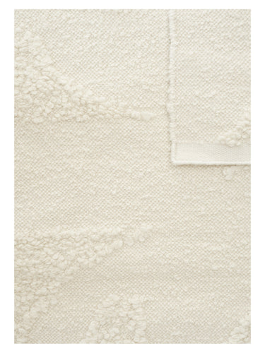 Alfombra Polar Angels blanca de Linie Design, esquina doblada con el reverso visible