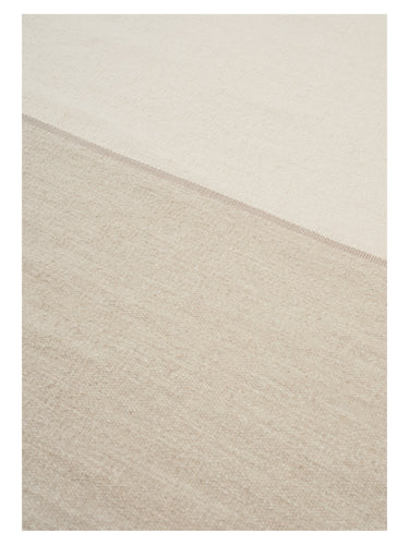 Alfombra redonda beige Magnetize de Linie Design, detalle de la unión entre los dos tonos