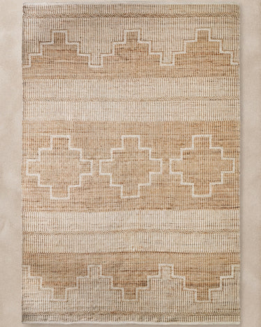 Alfombra de yute, algodón y fibra natural marrón de Vical sobre superficie topo clara