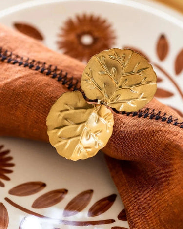 Caravane Floria gold-toned hammered brass napkin holder