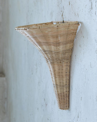 Detail of the Gina natural rattan wall sconce