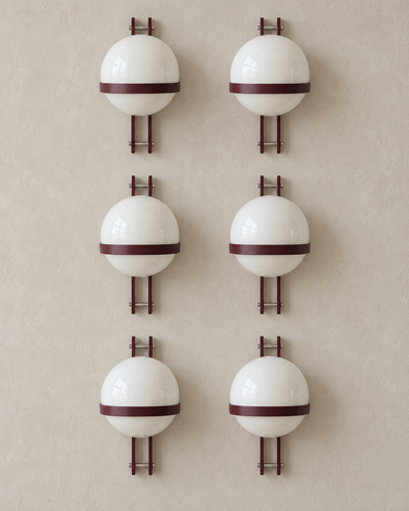Vintage burgundy Polinax wall light: six units on a pale taupe limewash wall