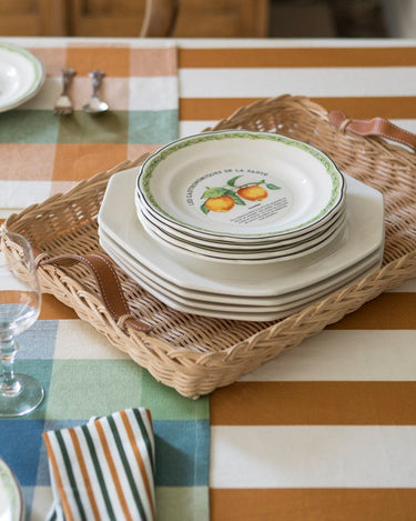 Rattan and glass tray on a styled table