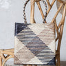 Hand-woven brown and black palm fiber bag