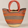 Bolso shopper artesanal de fibras naturales naranja, con dibujo geométrico y asas rojas, de Matuta Home