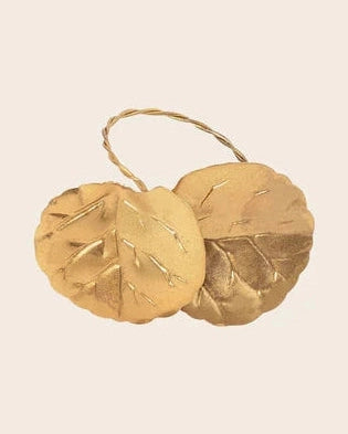 Detail of the Caravane gold-toned brass napkin holder