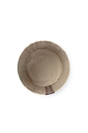 Cesta mediana de tule natural de Lorena Canals en un ambiente interior