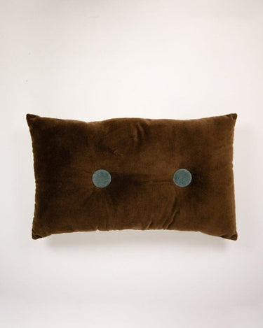 Brown buttoned decorative cushion by Olsson & Jensen