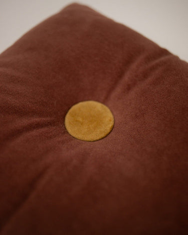Detail of the buttons on the pink velvet cushion by Olsson & Jensen