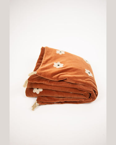Colchoneta Daisy óxido plegada con flores claras y borlas