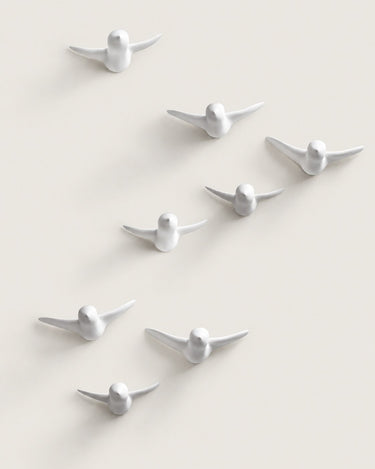 Conjunto de ganchos de pared blancos