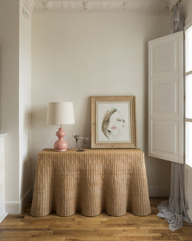 Handcrafted natural rattan console with a wavy edge