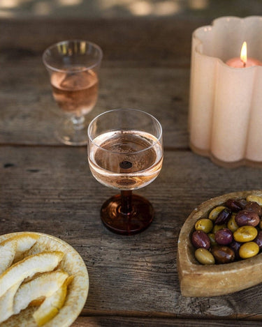 Amber wine glass by Olsson & Jensen on a styled table