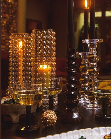 Green wine glass by Olsson & Jensen on an elegantly set table
