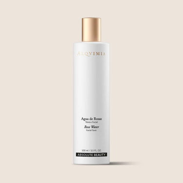 Tónico facial Agua de Rosas de Alqvimia de 100 ml, en envase blanco con tapa dorada sobre fondo beige.