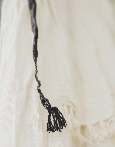 Surendra handcrafted linen-cotton curtain with a soft, light-filtering weave and fringed trim