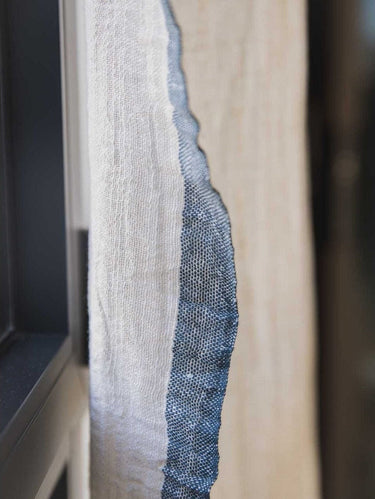 Surendra handcrafted linen-cotton curtain with a soft, light-filtering weave and fringed trim