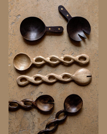 Detail of the charred finish on the wooden salad servers