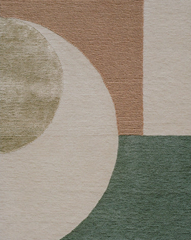 Detalle de alfombra redonda de lana bicolor Eternal Orb Linie Design con diseño de orbe eterno