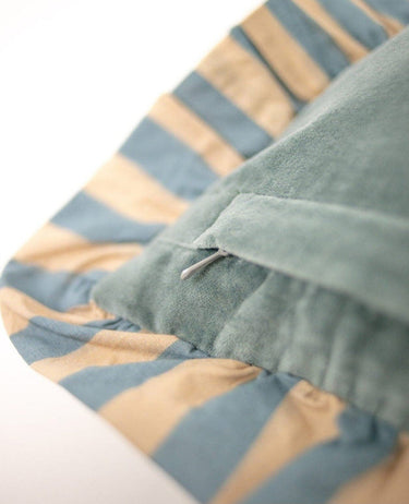 Detail of the striped ruffle on the blue cushion cover
