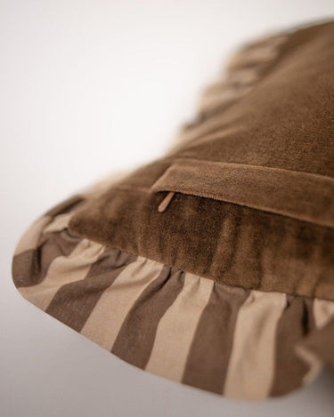 Brown cotton 30 x 50 cushion cover on a bed