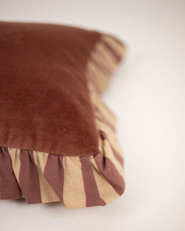 Pink gathered ruffled cushion cover by Olsson & Jensen on a sofa