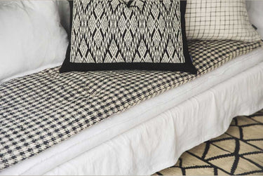 Cotton sofa cover with a houndstooth pattern