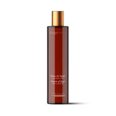 Gel de ducha de incienso y mirra de ALQVIMIA: envase ámbar alargado con tapón dorado, sobre fondo blanco.