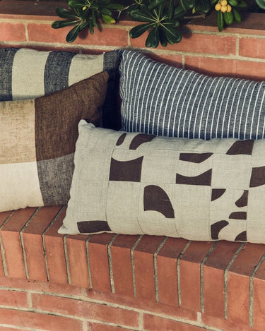 Linen and cotton patchwork cushion by HK Living in a styled setting