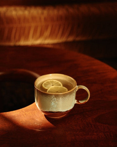 70s style stoneware tea cup set by HK Living in a showroom