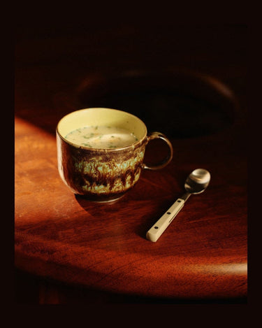 70s style stoneware tea cup set by HK Living in a styled setting
