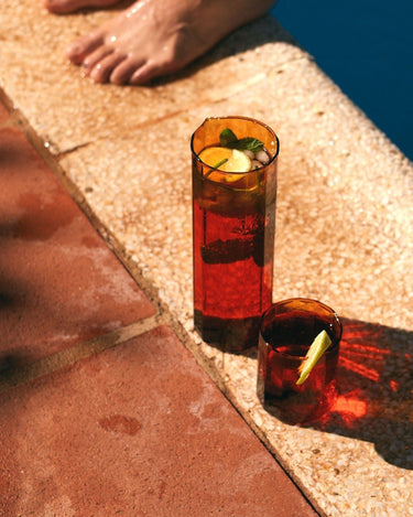 Amber borosilicate glass beaker by HK Living on a contemporary table