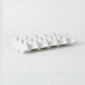 White ceramic egg holder for ten eggs by Olsson & Jensen