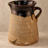 Vintage clay pitcher with dark glaze and a side handle, from Artesanías San José